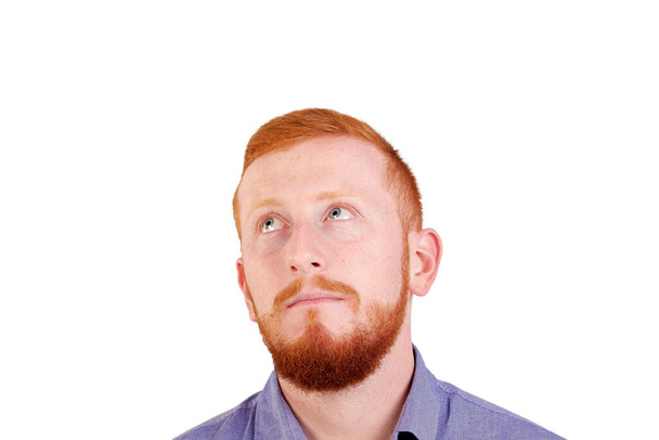 Thinking of something good. Portrait of redhead man with facial expression. - Φωτογραφία, εικόνα