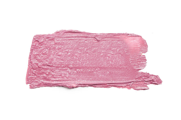 Roze ceamy make-up monster op witte achtergrond. Decoratieve cosmetische uitstrijkjes. - Foto, afbeelding