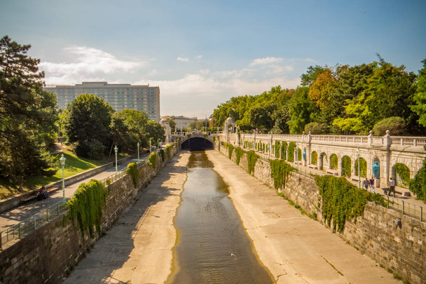 Austria Vienna. The Stadtpark is divided into unequal parts by the Vienna river bed, which is clad in stone, over which footbridges are thrown. - Photo, image