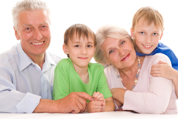 Elderly couple with their grandchildren - Foto, afbeelding
