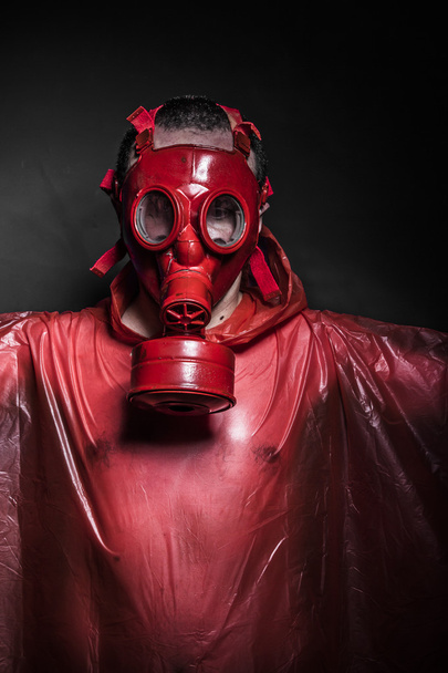 Man with red gas mask - 写真・画像
