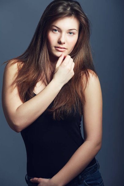 Shes a natural beauty. Studio shot of a beautiful young woman with long hair. - Foto, Imagem