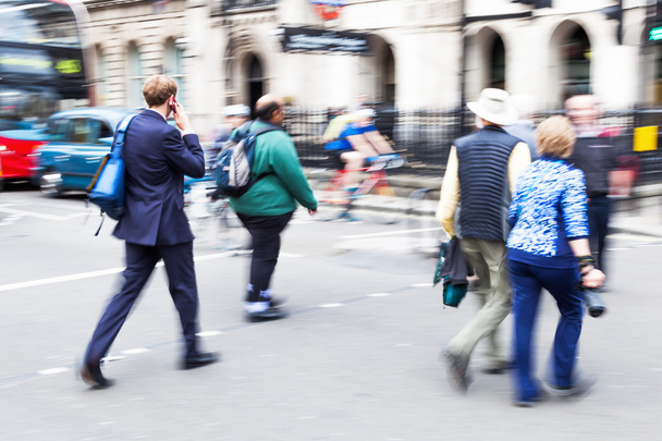 People in motion blur crossing a street in London City - Fotoğraf, Görsel