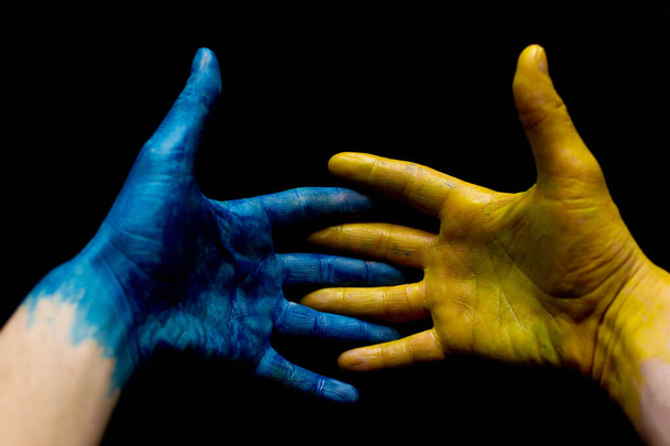Blue and yellow ukrainian hands isolated symbolic - Photo, image