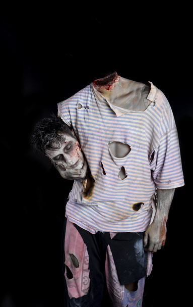 Decapitated zombie holding his own head - Photo, image