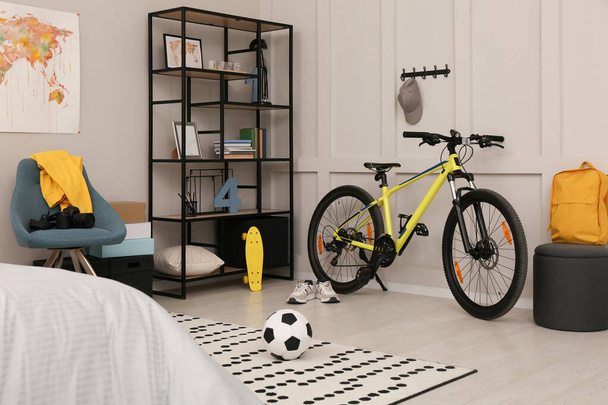 Sports equipment in stylish teenager's room interior - Photo, Image