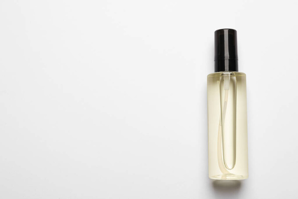Bottle of baby oil on white background, top view. Space for text - 写真・画像