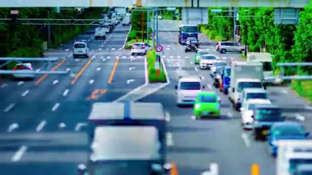 Uma timelapse da baixa da rua na avenida Kanpachi em Tóquio zoom durante o dia tilt-shift - Filmagem, Vídeo