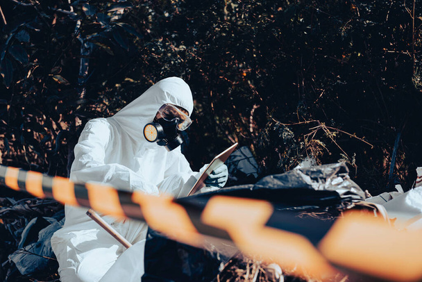 Asian scientist wear Chemical protection suit check danger chemical,working at dangerous zone,Collecting samples in case of Corona virus investigation outbreaked from China. - Foto, afbeelding