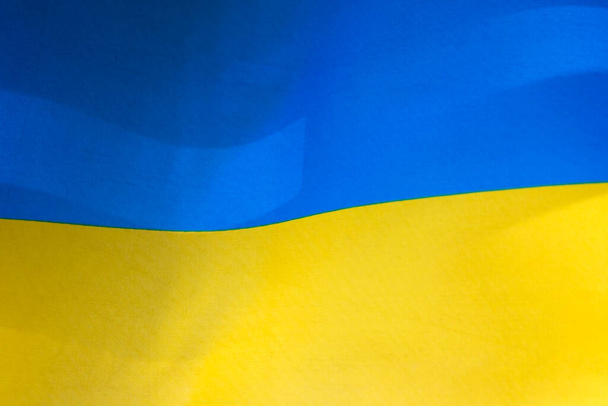 Flag of Ukraine, UA. Blue and yellow colors. Close up shot, background - Valokuva, kuva