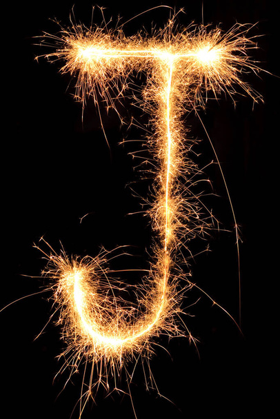 Burning Sparkling number 0 zero isolated on black background. Beautiful Glowing design element for greeting card, holiday flyer. - Foto, Imagen
