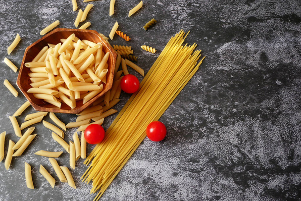 Various types of pasta, Raw pasta set and tomato, set, closeup - Photo, Image