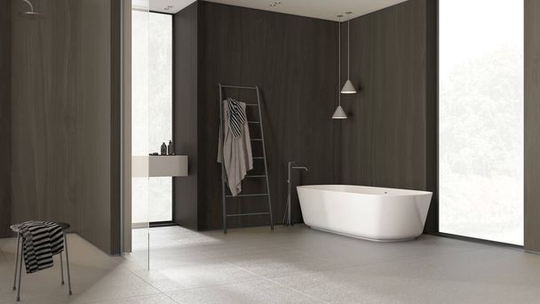 Moderne minimalistische badkamer met houten muren in donkere tinten, vrijstaand bad, wastafel, spiegel, accessoires, keramische tegels, hanglampen, ramen, interieur concept - Foto, afbeelding