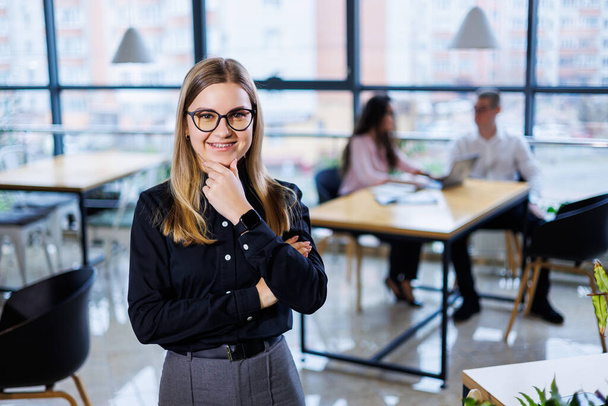 Young woman businessman. Business team organization and investment plans while working on a new startup project with diagrams, graphs and business accessories in the workplace. - Photo, Image