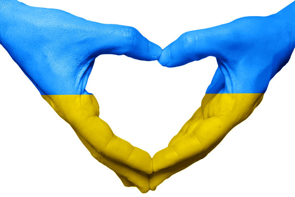 Ukrainan tukea lahjoittaa kädet sormet kuin sydän tekee rakkautta tausta - Valokuva, kuva