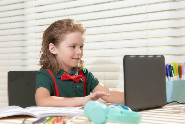 School boy pupil is studying online. Home schooling. Kids distance learning. Cute child using laptop. Education, online study, home studying, homework, schoolboy concept. - Foto, Bild