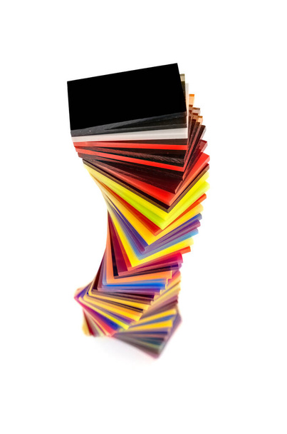 spiral Stack of different colours Cast Acrylic Sheet on white background - Foto, imagen