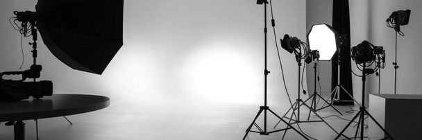 photographic studio with lighting backdrop and various equipment for photos and video shooting. banner - Valokuva, kuva