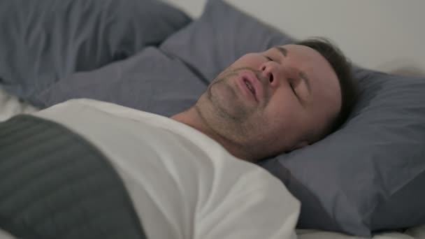 Close up Middle Aged Man having Headache while Sleeping in Bed - Metraje, vídeo