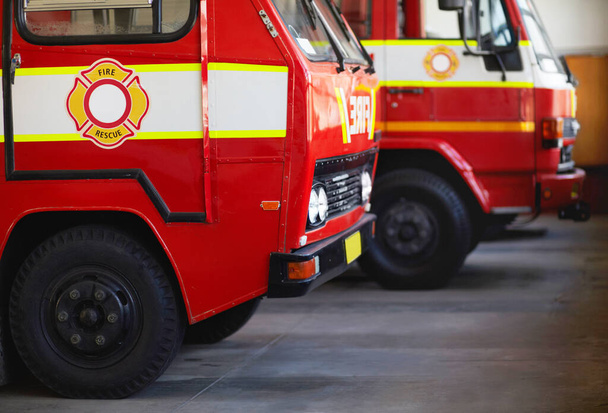 Ready for action. Cropped shot of parked fire engines. - Photo, Image