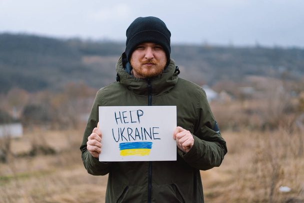 War of Russia against Ukraine. Ukrainian man asks to stop the war in Ukraine. - Fotoğraf, Görsel