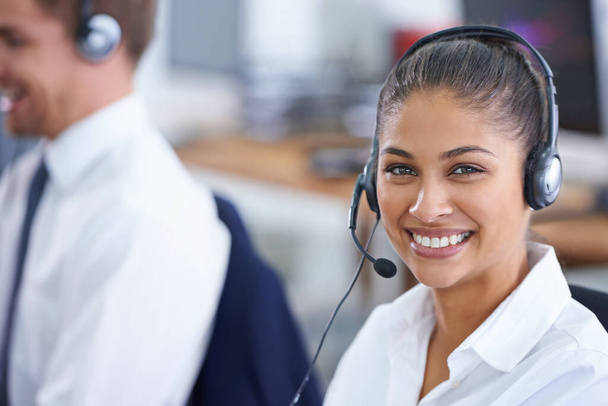 Thats a smile for sales. Shot of a young woman wearing a headset. - Photo, Image