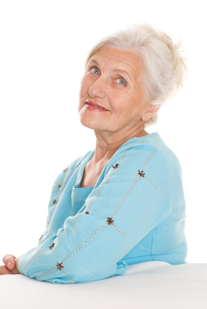 Beautiful older woman on a white - Фото, зображення