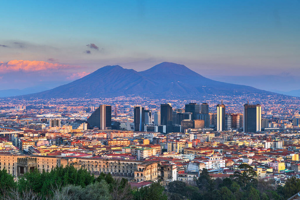 Naples, Italy with the financial district skyline under Mt. Vesuvius at twilight. - Photo, Image