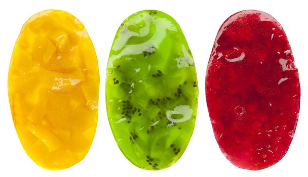 Набор из трех овальных фруктовых десертов желе из красного, зеленого и оранжевого
 - Фото, изображение