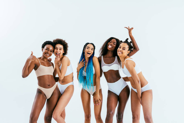 Beauty portrait of beautiful black women wearing lingerie underwear - Pretty african young women posing in studio, concepts about beauty, cosmetology and diversity - Zdjęcie, obraz