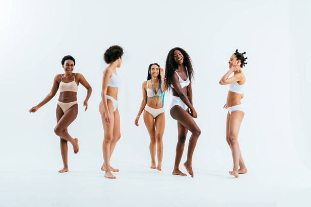 Beauty portrait of beautiful black women wearing lingerie underwear - Pretty african young women posing in studio, concepts about beauty, cosmetology and diversity - Photo, Image