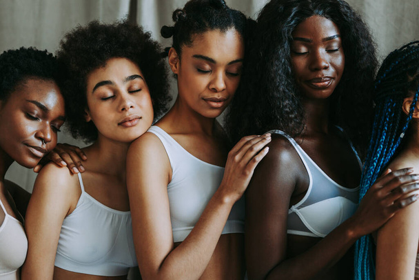 Beauty portrait of beautiful black women wearing lingerie underwear - Pretty african young women posing in studio, concepts about beauty, cosmetology and diversity - Foto, Bild