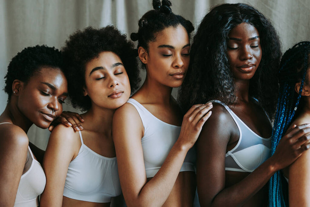 Beauty portrait of beautiful black women wearing lingerie underwear - Pretty african young women posing in studio, concepts about beauty, cosmetology and diversity - Foto, immagini