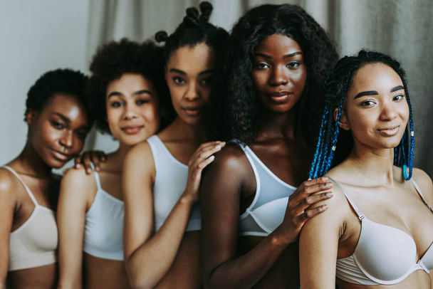 Beauty portrait of beautiful black women wearing lingerie underwear - Pretty african young women posing in studio, concepts about beauty, cosmetology and diversity - Fotó, kép
