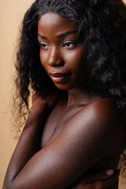 Beauty portrait of beautiful black woman wearing lingerie underwear - Pretty african young woman posing in studio, concepts about beauty, cosmetology and diversity - Фото, зображення