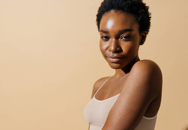 Beauty portrait of beautiful black woman wearing lingerie underwear - Pretty african young woman posing in studio, concepts about beauty, cosmetology and diversity - Foto, immagini
