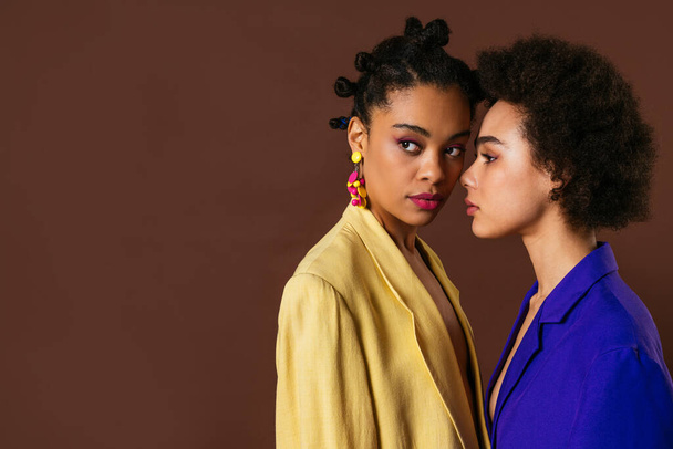 Beauty portrait of beautiful black women wearing lingerie underwear and colored blazers - Pretty african young women posing in studio, concepts about beauty, cosmetology and diversity - Φωτογραφία, εικόνα