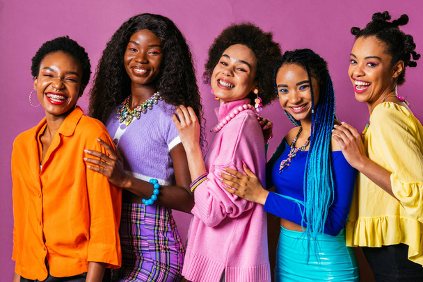 Beauty portrait of beautiful black women wearing colorful stylish clothes - Pretty african young women posing in studio, concepts about beauty, cosmetology and diversity - Zdjęcie, obraz