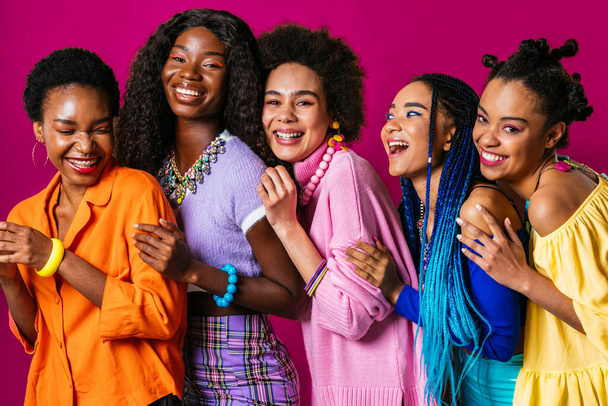 Beauty portrait of beautiful black women wearing colorful stylish clothes - Pretty african young women posing in studio, concepts about beauty, cosmetology and diversity - Valokuva, kuva