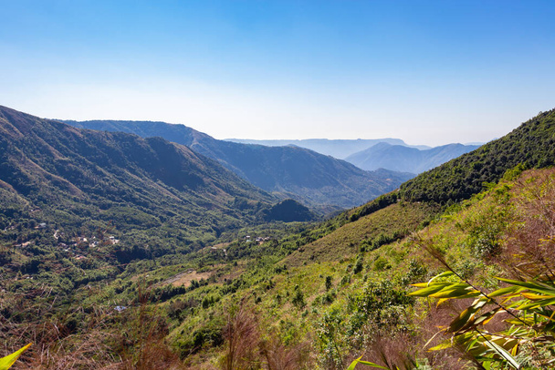 mountain range covered with dense green forests and bright blue sky at morning image is taken at meghalaya india. - Photo, Image