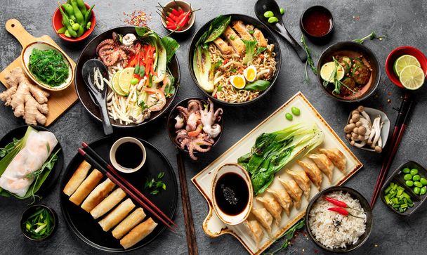Asian food on dark background, top view. - Valokuva, kuva