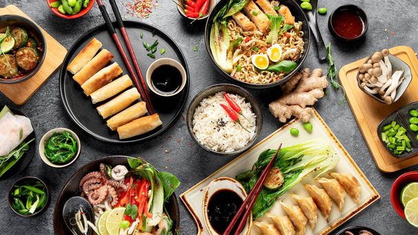 Asian food on dark background, top view. - Photo, Image