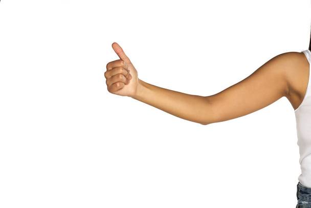 female hand with thumb up, hitchhiking sign on white background - Photo, Image