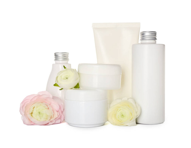 Set of cosmetic products and ranunculus flowers on white background - Foto, Bild