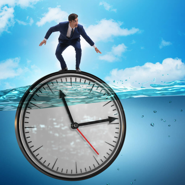Бизнесмен в концепции управления сроками и временем - Фото, изображение