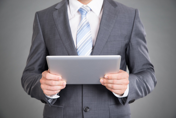 Businessman hands holding tablet computer - 写真・画像