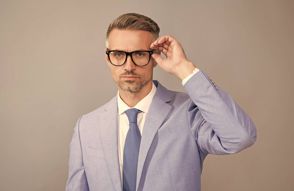 optical eyecare. guy look like nerd. smart and confident businessman in suit. - 写真・画像
