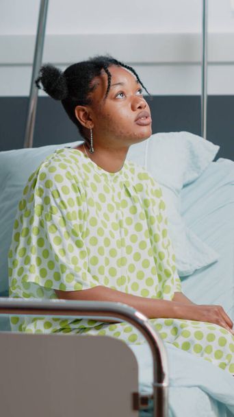 Sick patient waiting on doctor to give treatment and support - Foto, imagen