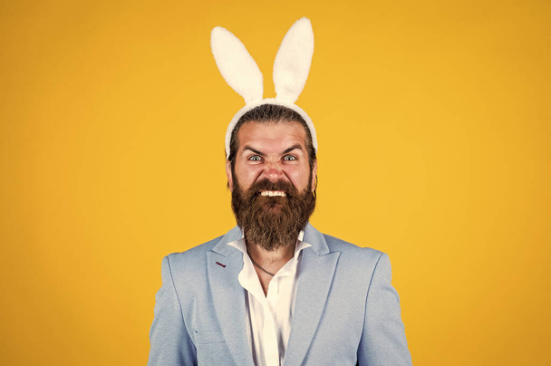 mature bearded male guy looking elegant wearing bunny ears, easter - Foto, Imagen