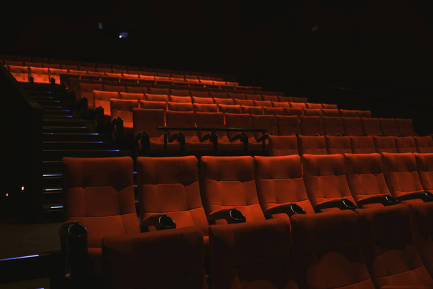 Red colored cinema seats with no people. - Foto, Imagen